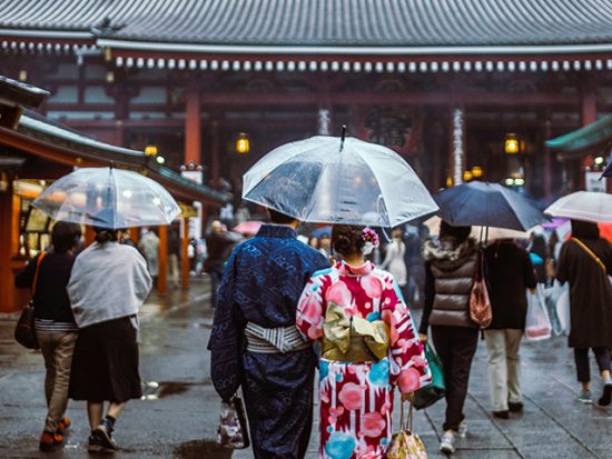 Couple Walking in the rain at Sensō-ji temple in Tokyo, Japan