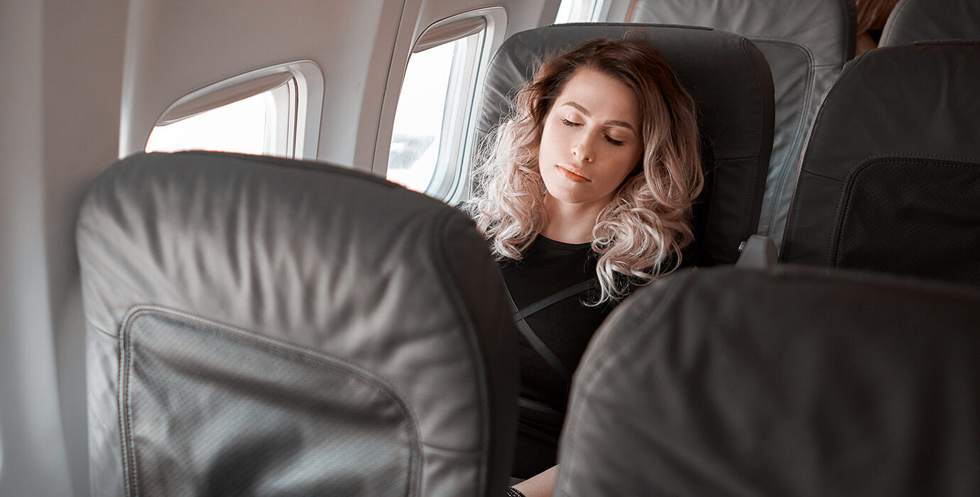 How to Sleep On a Plane (For Real): Tips for Snoozing at 30,000 Feet.